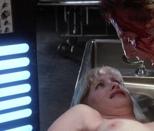 Barbara Crampton nude - Re-Animator (1985)