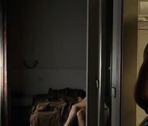 Suggestive woman actor in explicit moments from erotic movie where she has sex