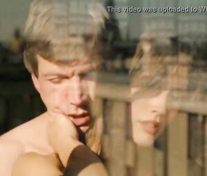 Suggestive woman actor in explicit moments from erotic movie where she has sex