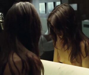 Suggestive woman actor in explicit moments from erotic movie where she has sex