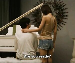 Asian piano teacher takes students hands and puts on small tits in Korean feature movie