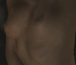 Director focuses on Sonya Cullingford's nice boobies showing them in The Danish Girl