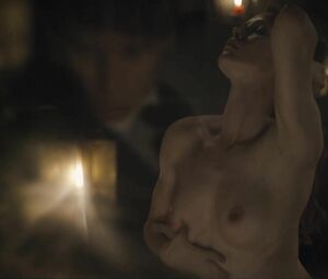 Director focuses on Sonya Cullingford's nice boobies showing them in The Danish Girl