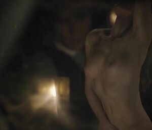 Director focuses on Sonya Cullingford's nice boobies showing them in The Danish Girl