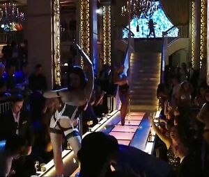 Explicit scene in the striptease club from comedy film The Internship with pole-dances