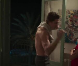 Tempting actress watches handsome young man getting naked and throws herself at him