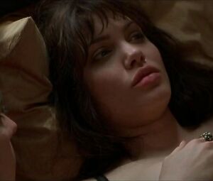 Pushing Tin moment where teen Angelina Jolie with full lips shows her thighs and titties