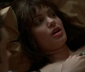 Pushing Tin moment where teen Angelina Jolie with full lips shows her thighs and titties
