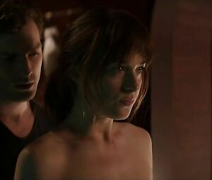 Dakota Johnson shows off tiny boobies and hooks up with guy in Fifty Shades of Grey