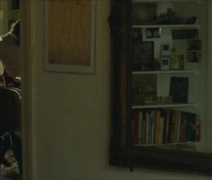 Lewd Vimala Pons is watched by man smoking on balcony in J'aurais Pu être Une Pute