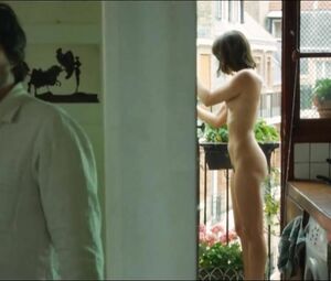 Lewd Vimala Pons is watched by man smoking on balcony in J'aurais Pu être Une Pute