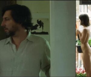 Lewd Vimala Pons is watched by man smoking on balcony in J'aurais Pu être Une Pute