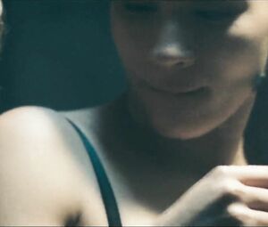 Girl with black hair is attacked by two naked co-stars in Return to House on Haunted Hill