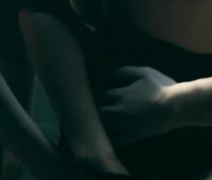 Girl with black hair is attacked by two naked co-stars in Return to House on Haunted Hill