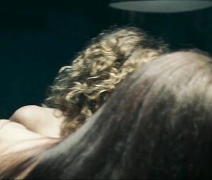 Girl with black hair is attacked by two naked co-stars in Return to House on Haunted Hill