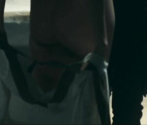 Girl with black hair is attacked by two naked co-stars in Return to House on Haunted Hill