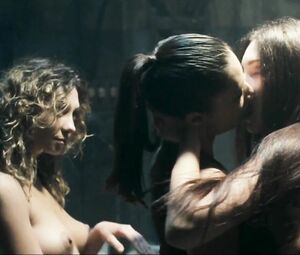 Girl with black hair is attacked by two naked co-stars in Return to House on Haunted Hill