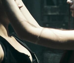 Girl with black hair is attacked by two naked co-stars in Return to House on Haunted Hill