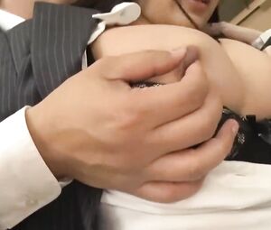 Asian babe touches co-worker's penis with feet and sucks till he cums on her lingerie