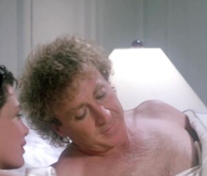 Kelly LeBrock nude - The Woman in Red (1984)